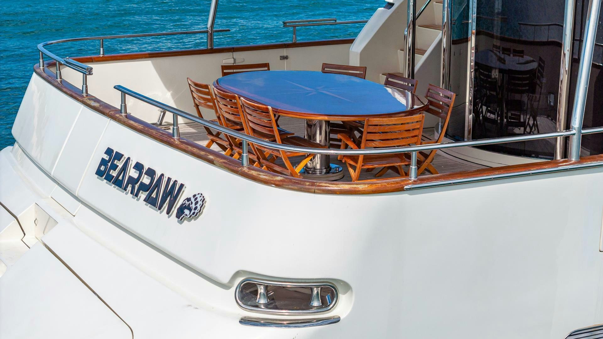 a boat with a table and chairs aboard 100 AZIMUT JUMBO Yacht for Sale