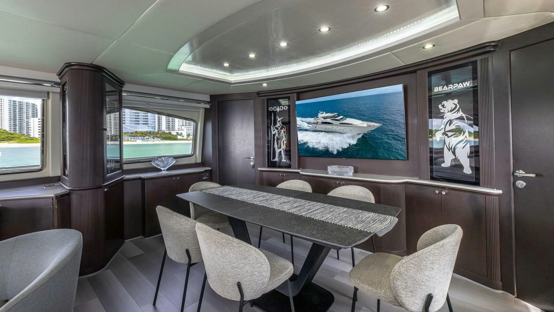 a room with a table and chairs aboard 100 AZIMUT JUMBO Yacht for Sale