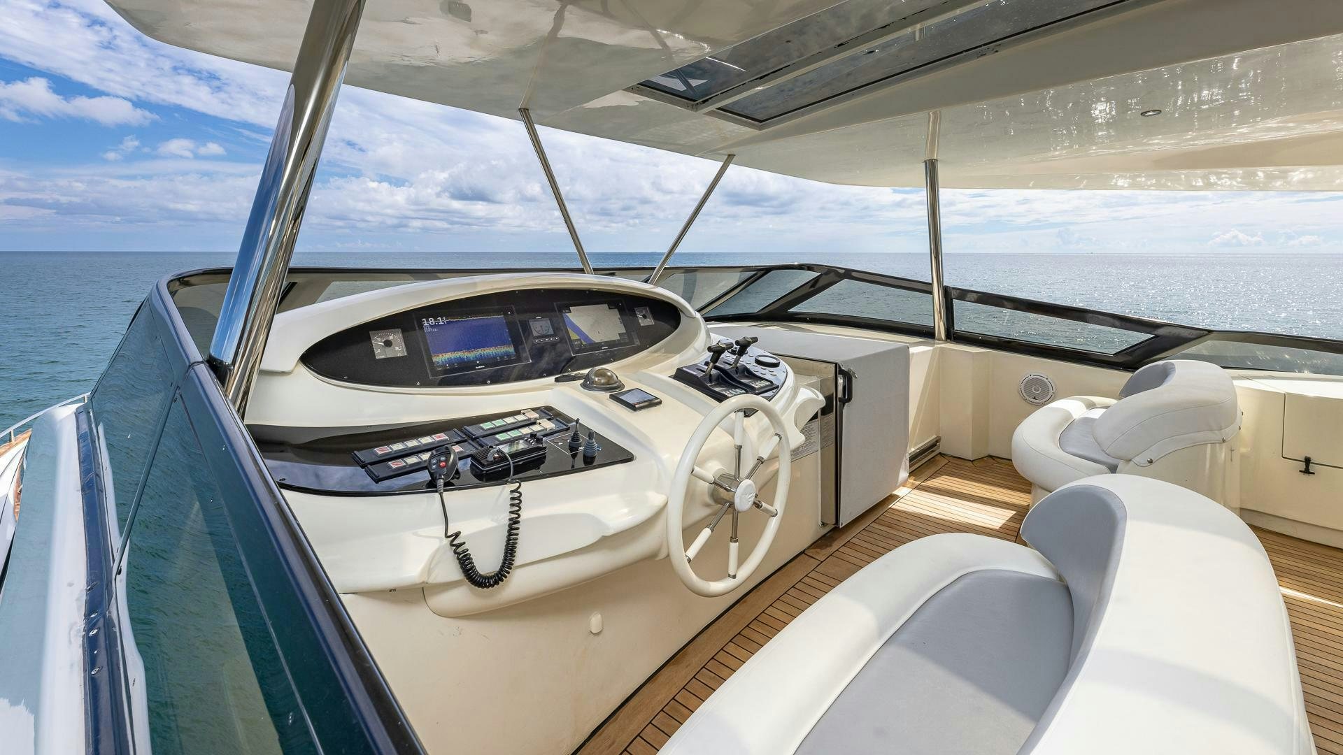 a boat with a steering wheel aboard 100 AZIMUT JUMBO Yacht for Sale