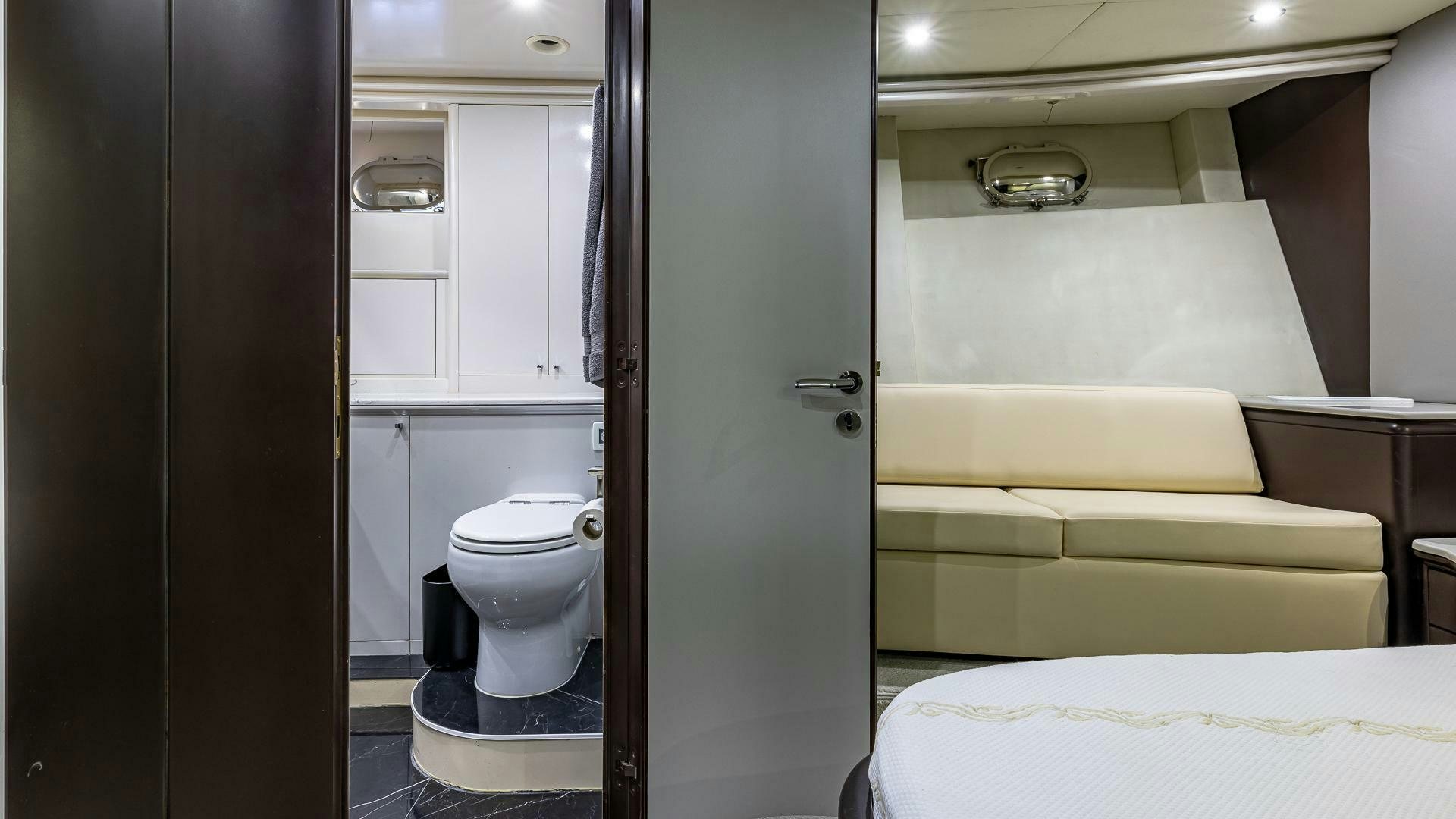 a bathroom with a bed and a closet aboard 100 AZIMUT JUMBO Yacht for Sale