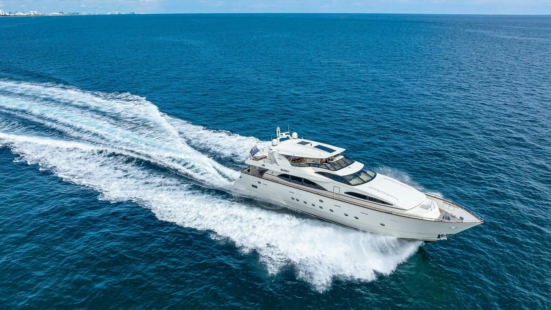 a white yacht on the water aboard 100 AZIMUT JUMBO Yacht for Sale