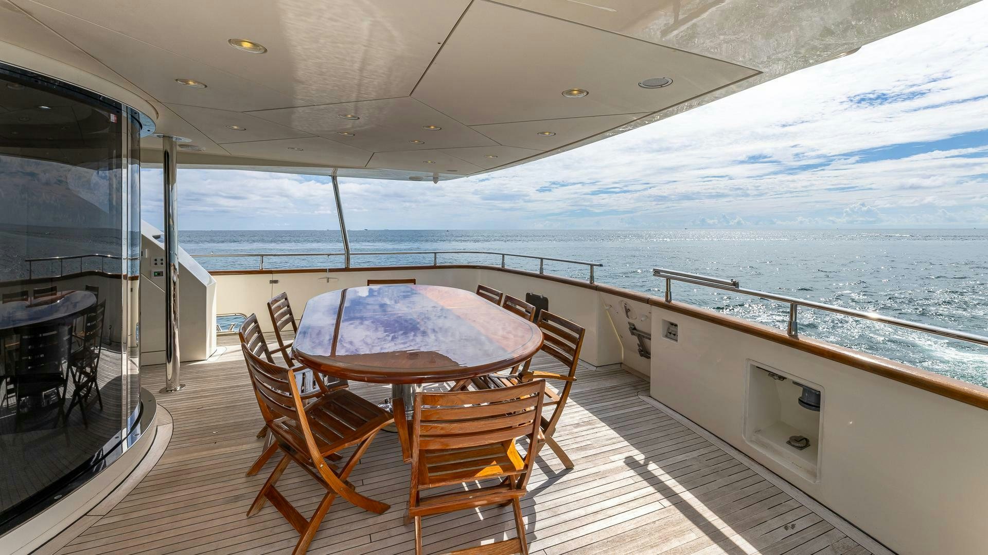 a table on a boat aboard 100 AZIMUT JUMBO Yacht for Sale