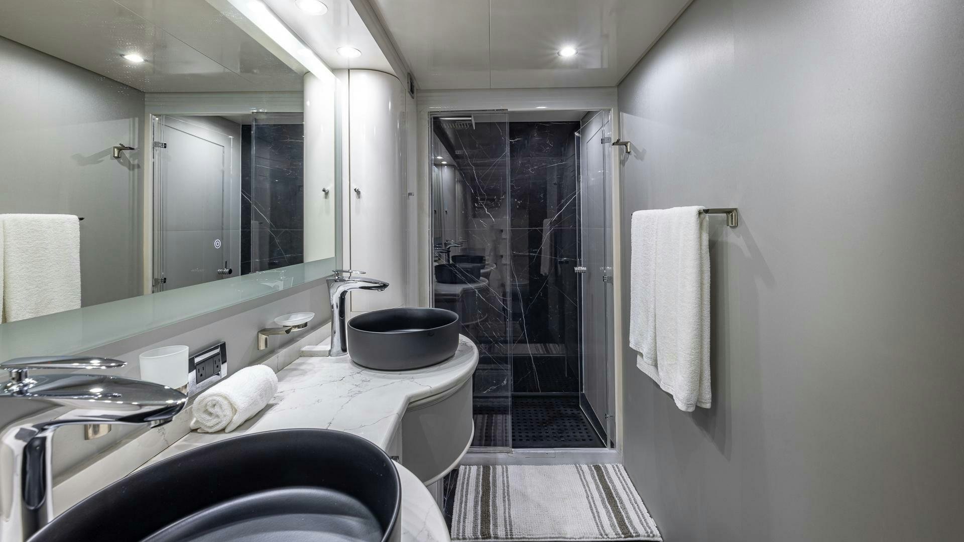 a bathroom with a large mirror aboard 100 AZIMUT JUMBO Yacht for Sale