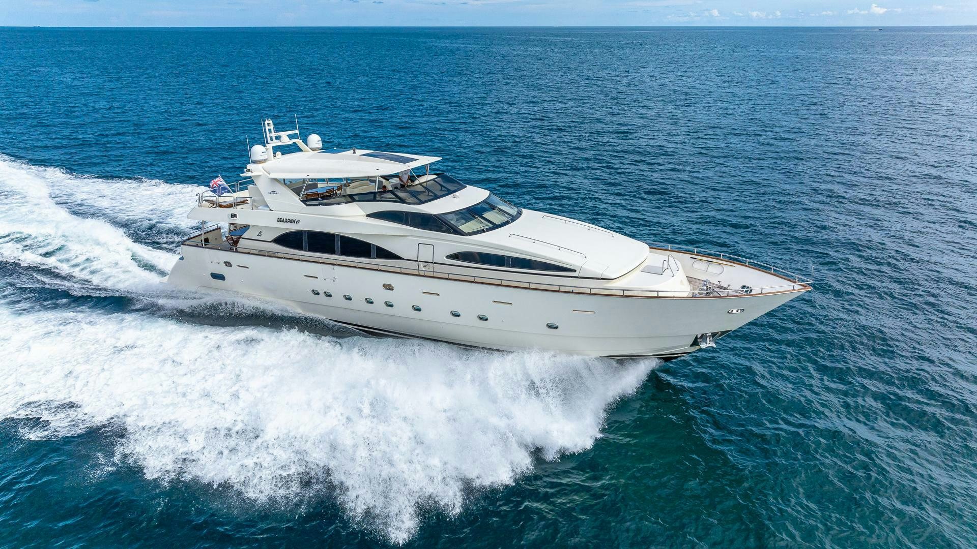 a white yacht on the water aboard 100 AZIMUT JUMBO Yacht for Sale