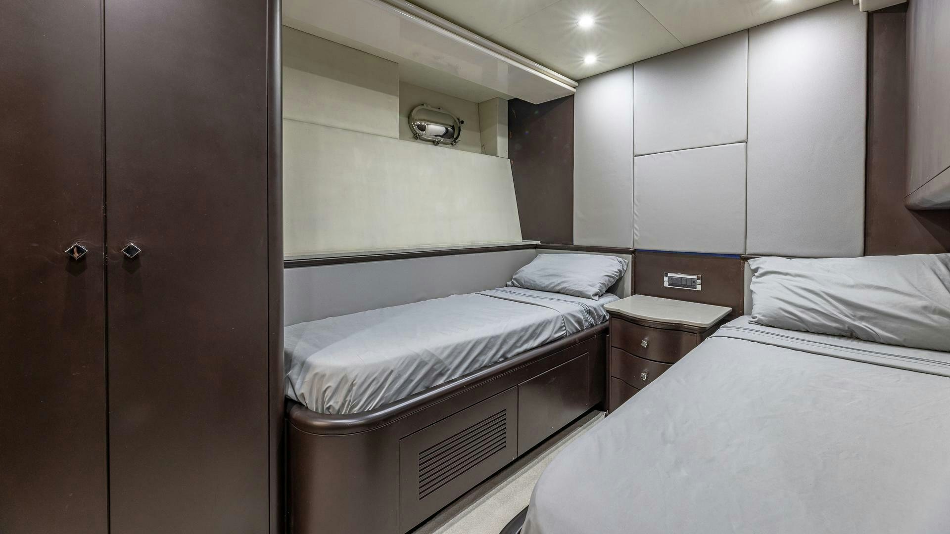 a room with two beds aboard 100 AZIMUT JUMBO Yacht for Sale