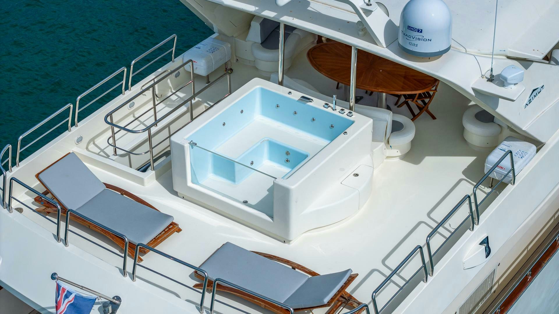 a white boat on a body of water aboard 100 AZIMUT JUMBO Yacht for Sale