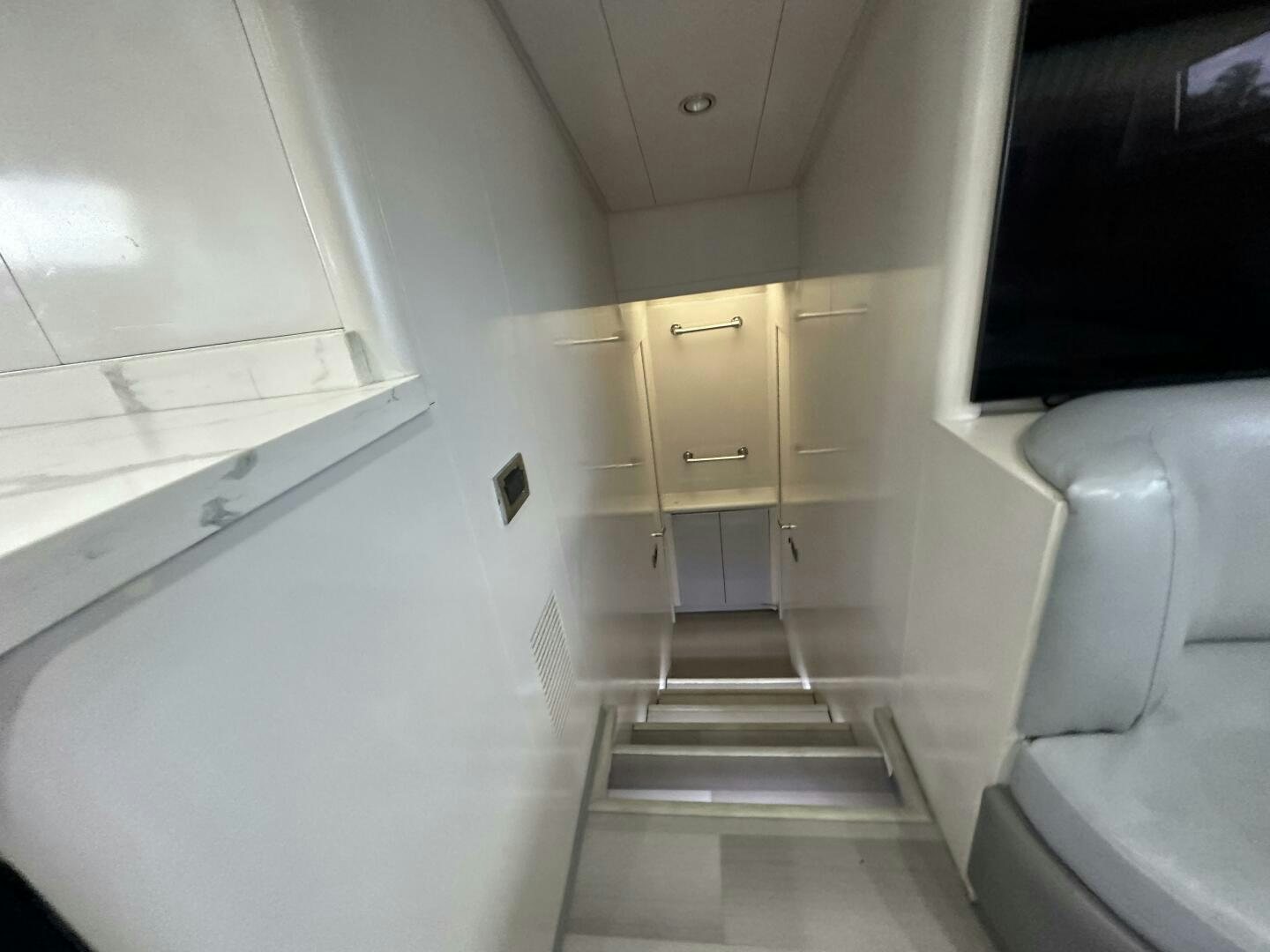 a white room with a door and a window aboard 100 AZIMUT JUMBO Yacht for Sale