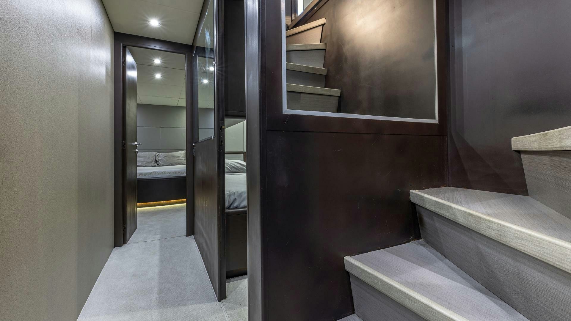 a room with a bed and a door aboard 100 AZIMUT JUMBO Yacht for Sale