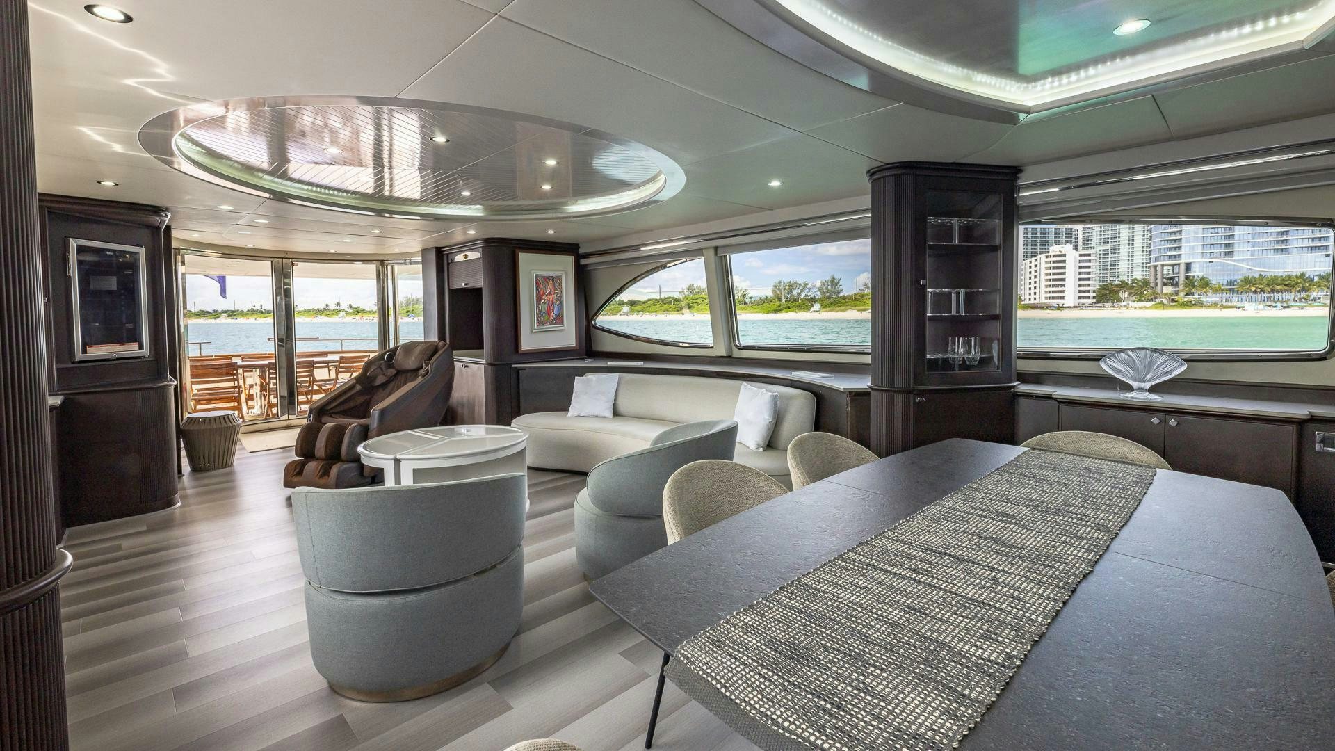 a living room with a large window aboard 100 AZIMUT JUMBO Yacht for Sale