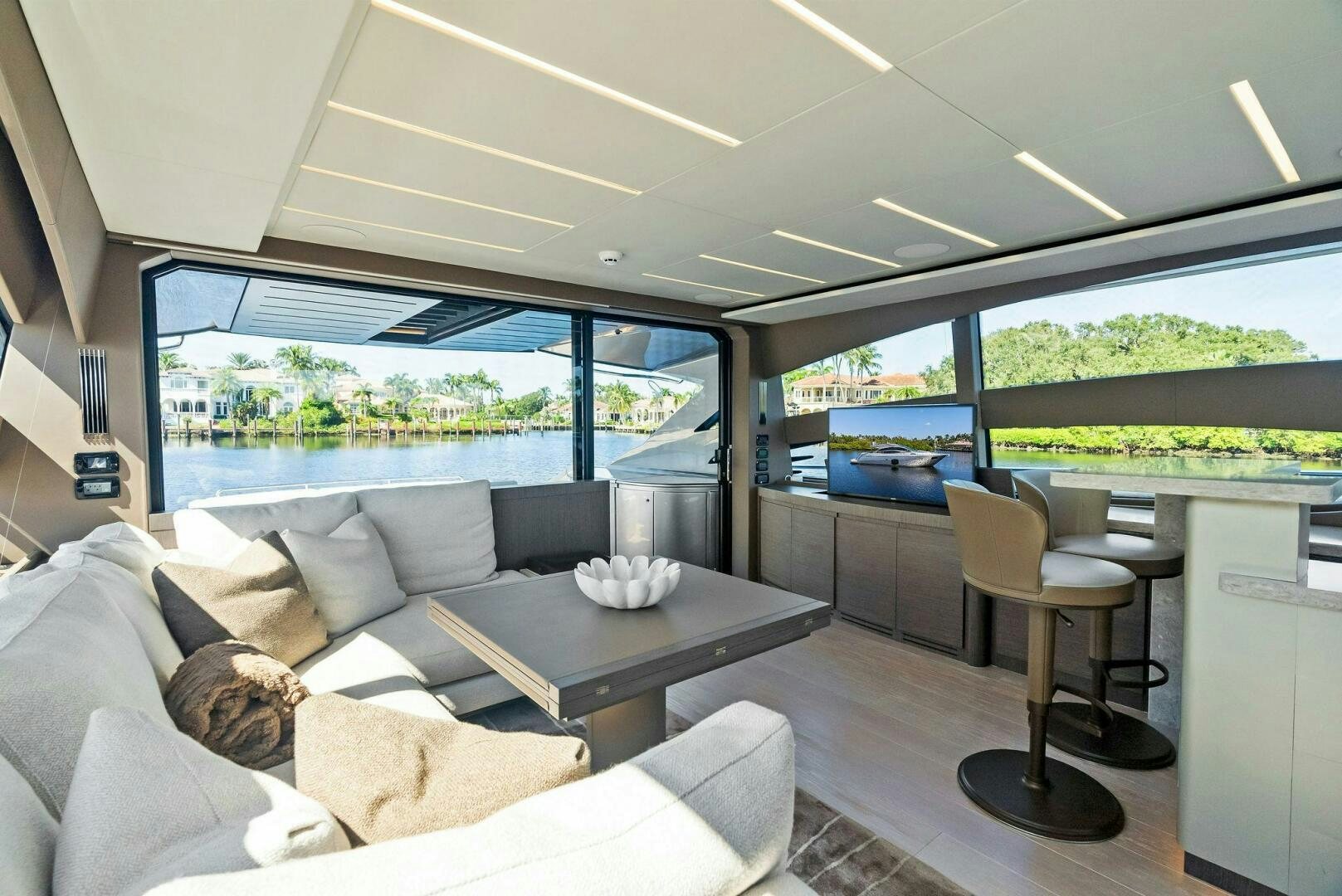 a living room with a large window aboard G Yacht for Sale