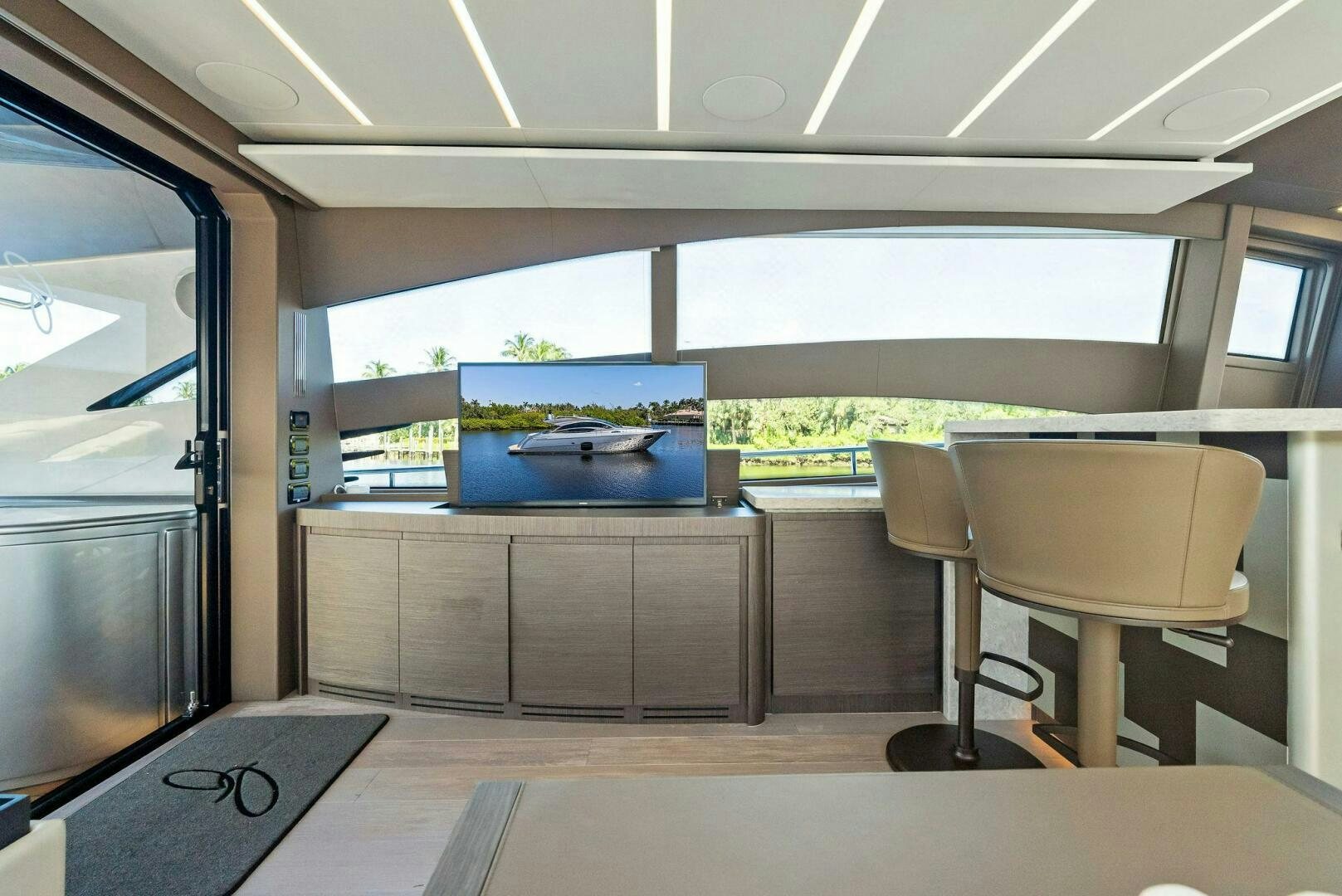 a room with a table and chairs aboard G Yacht for Sale