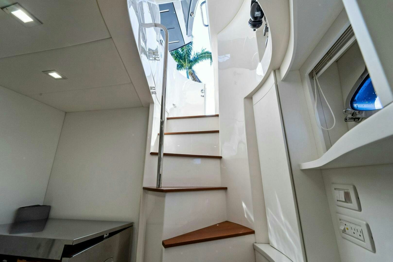 a staircase with a white wall aboard G Yacht for Sale