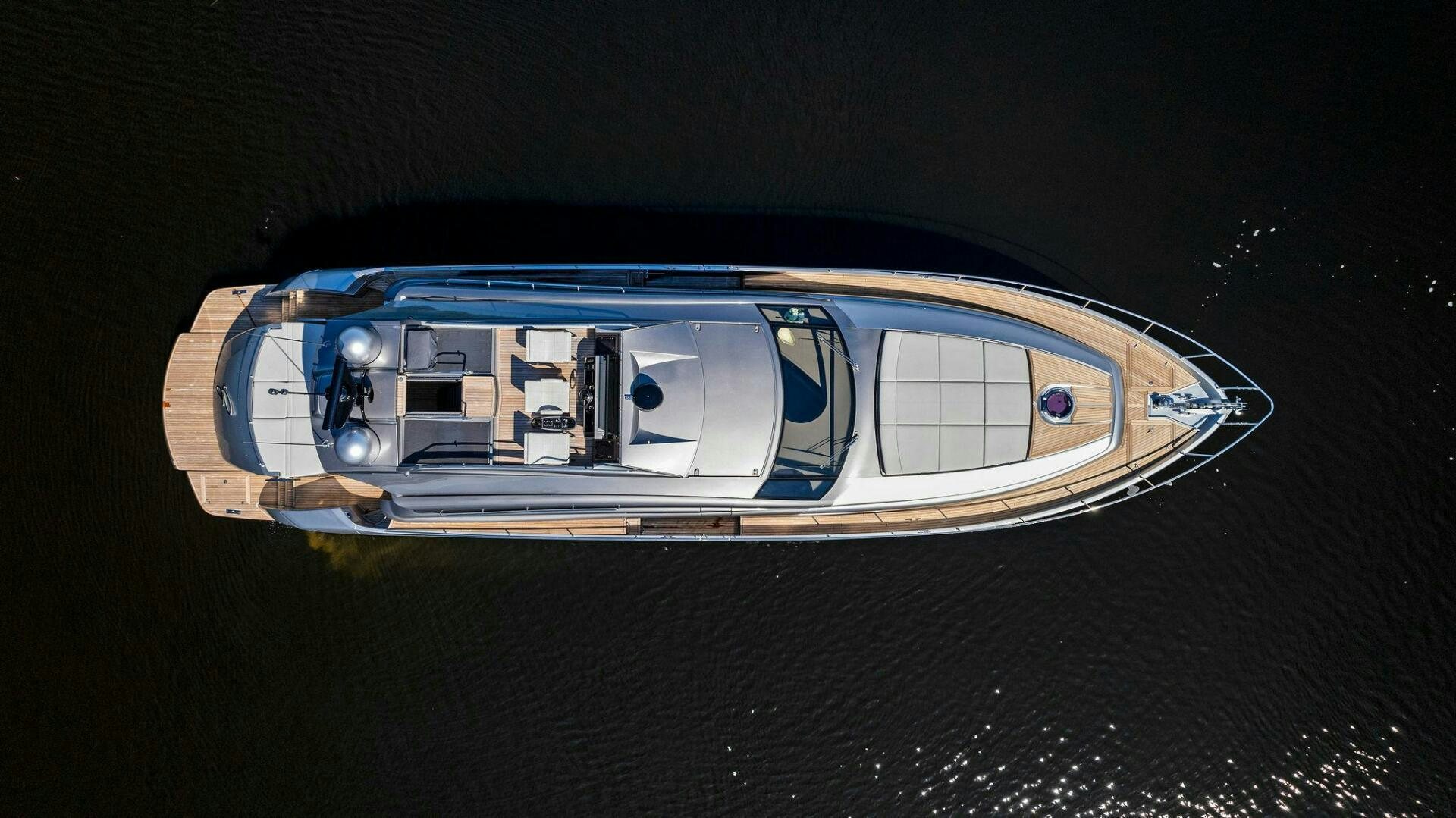 a blue and silver car aboard G Yacht for Sale