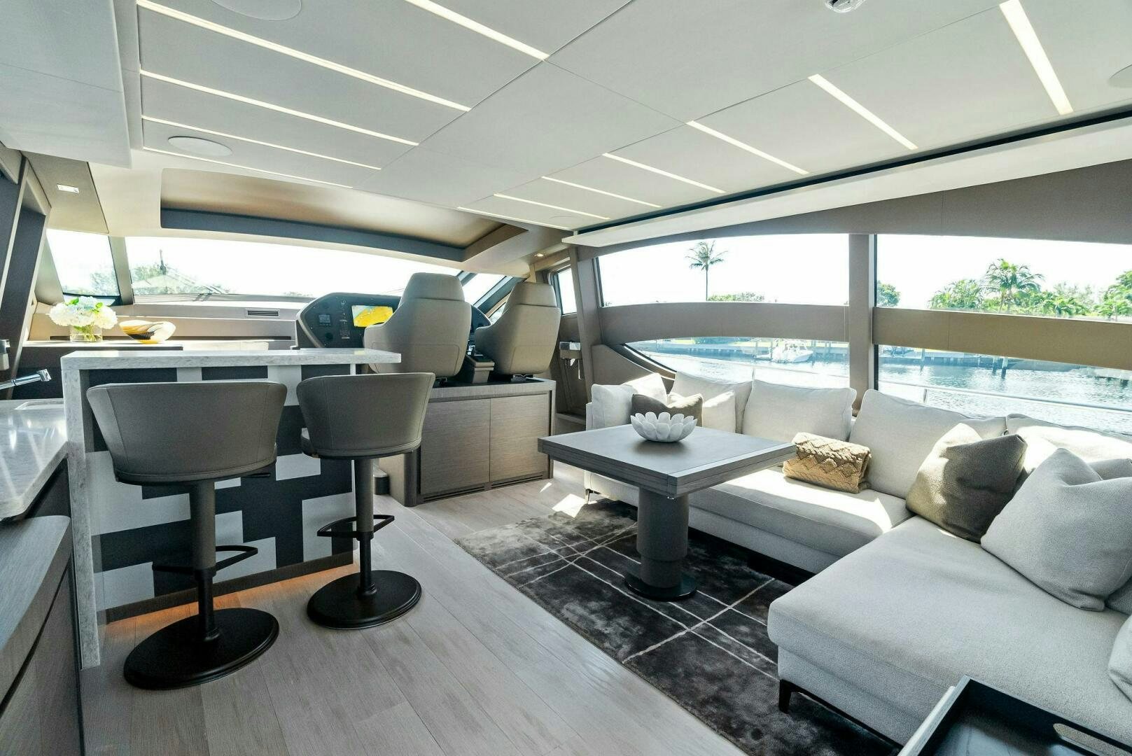 a room with a couch and a table and chairs aboard G Yacht for Sale
