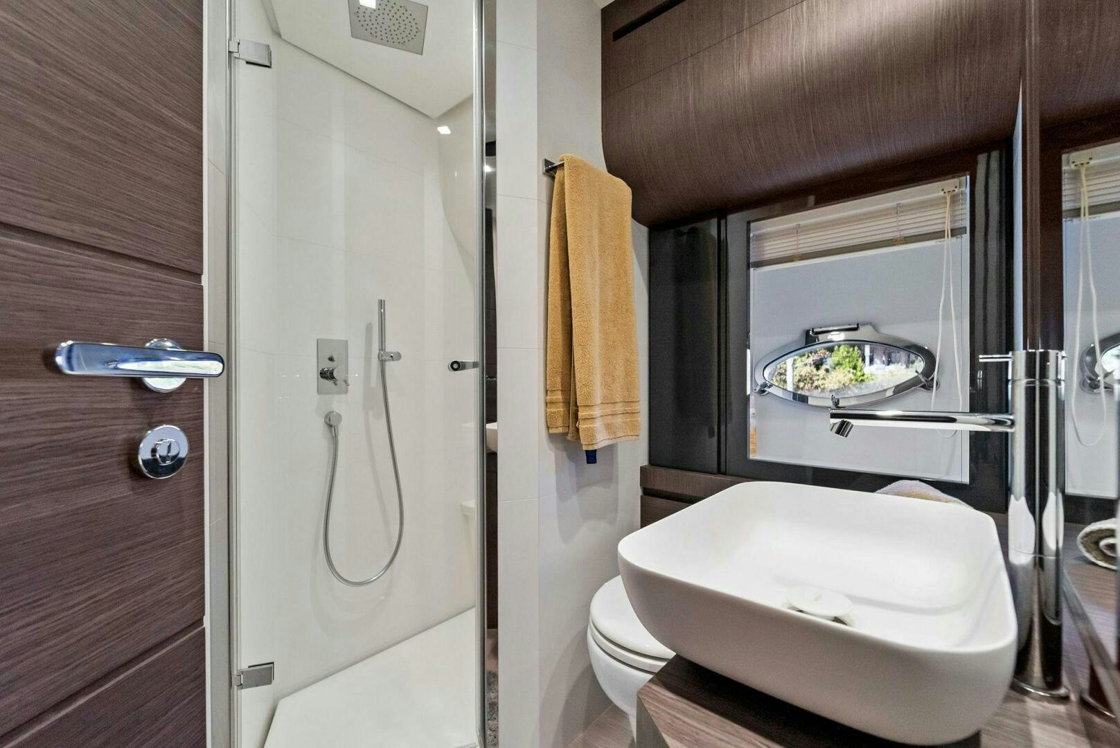 a bathroom with a tub sink and toilet aboard G Yacht for Sale