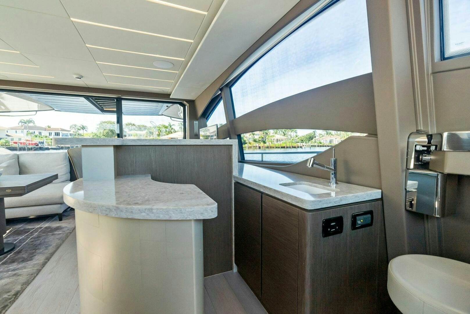 a kitchen with a table and a sink aboard G Yacht for Sale