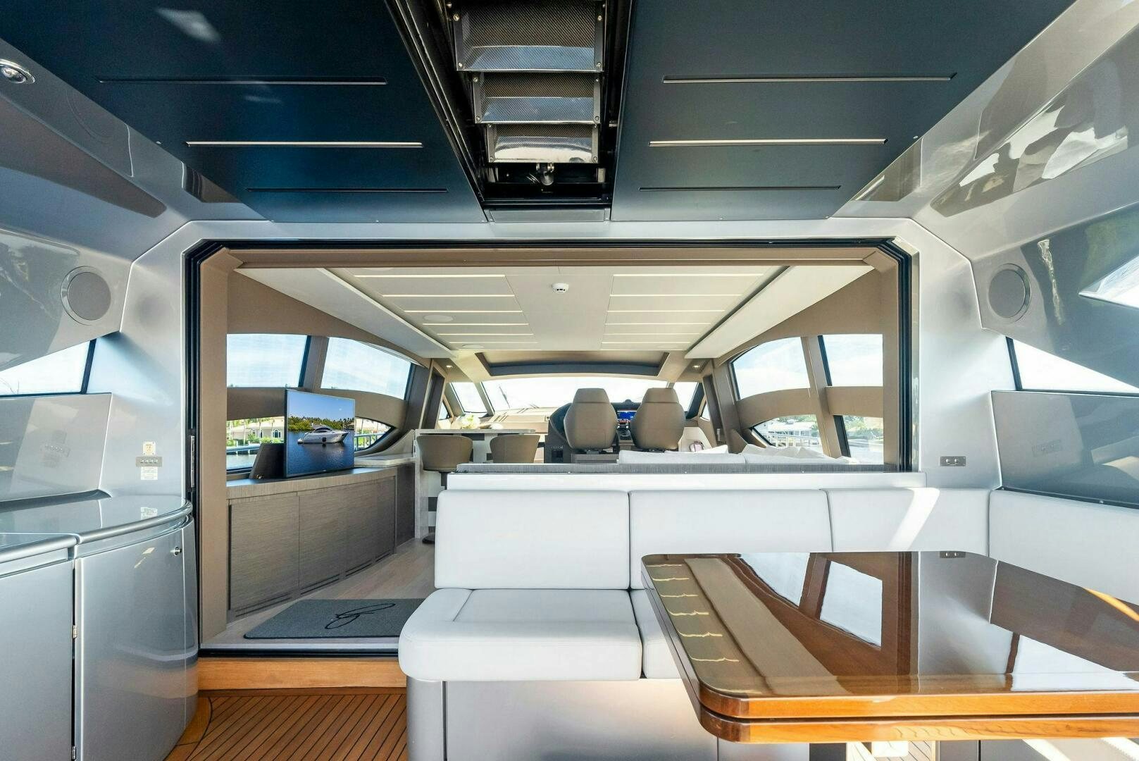 a room with a white table and chairs aboard G Yacht for Sale