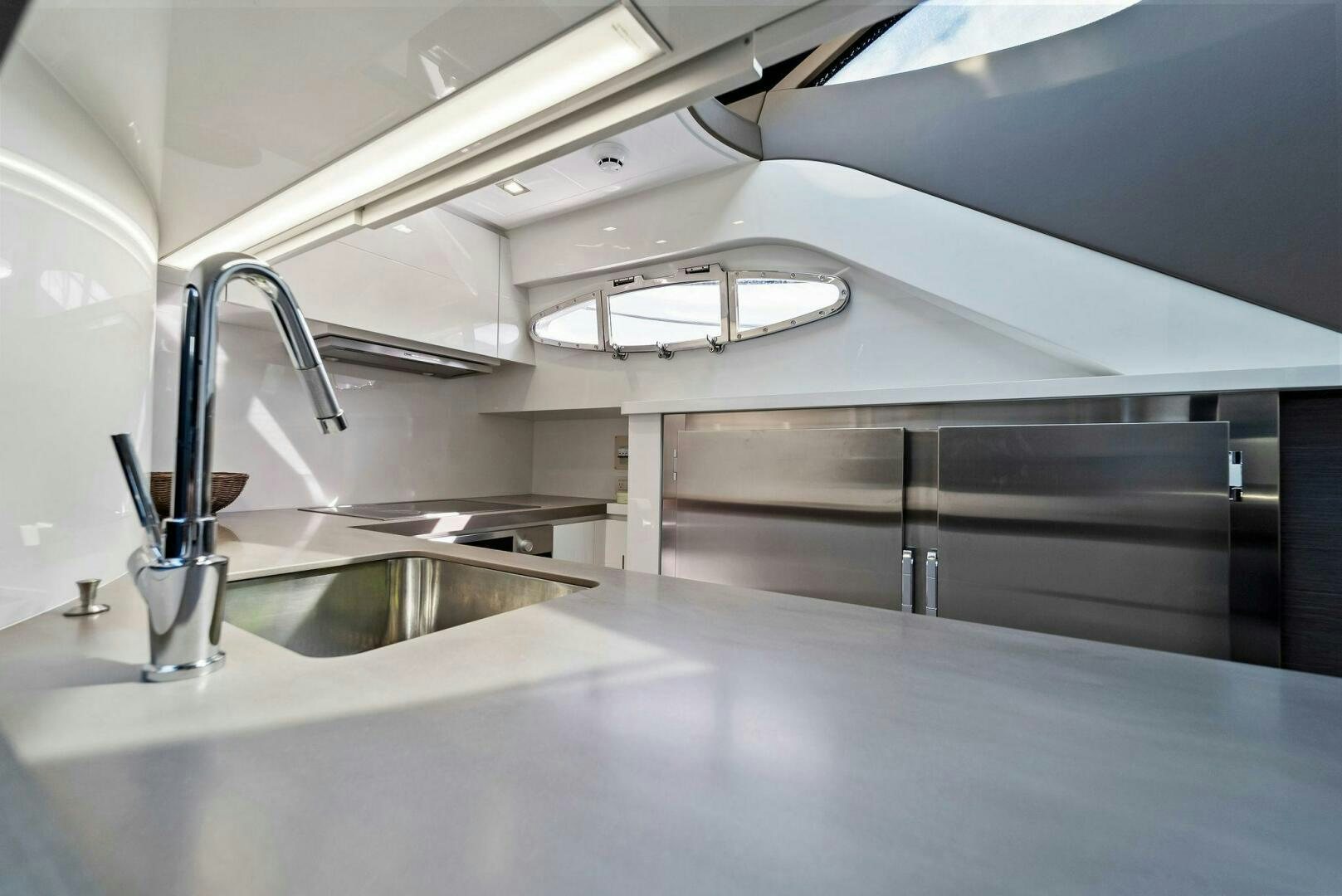 a kitchen with a sink and a faucet aboard G Yacht for Sale