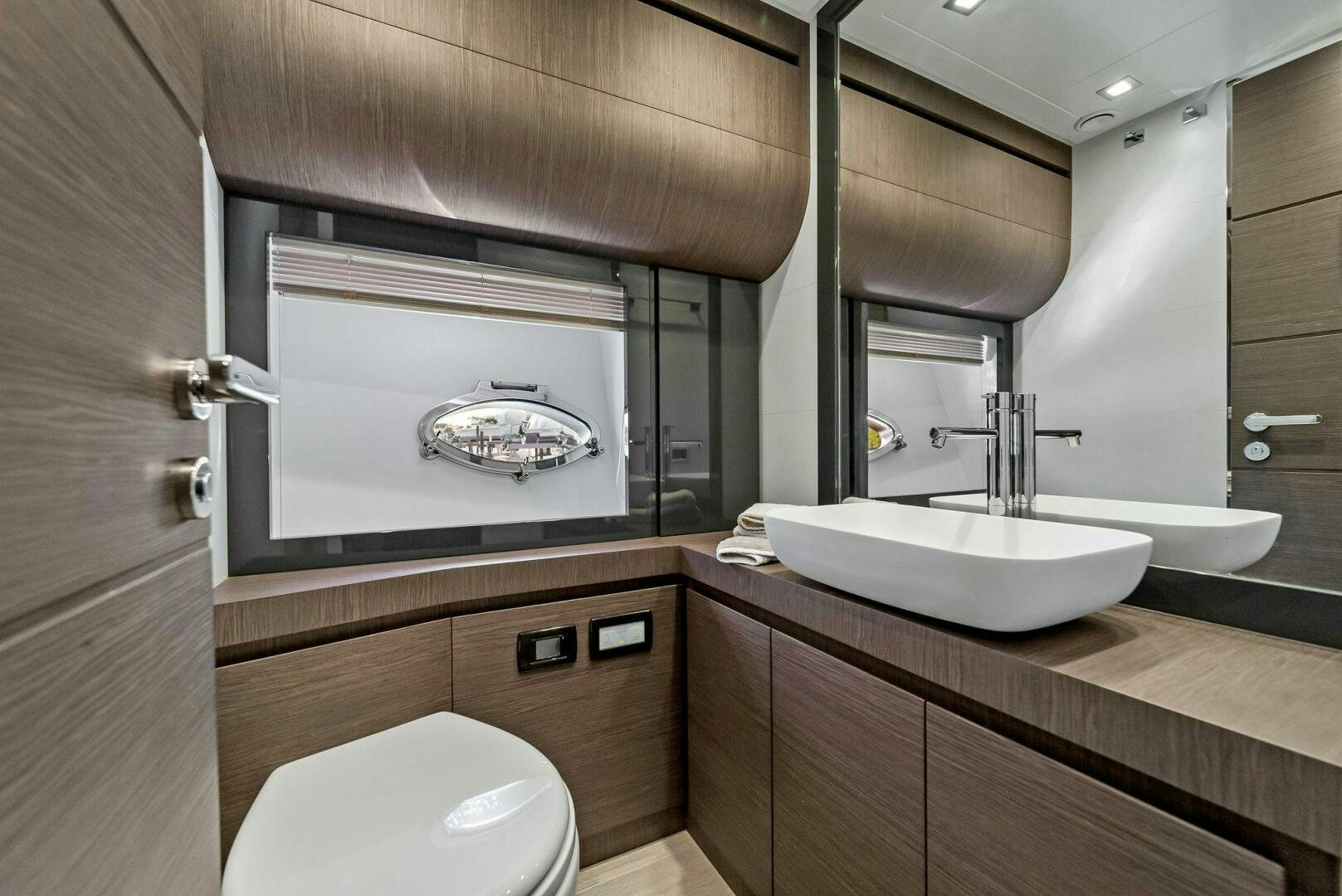 a bathroom with a large mirror aboard G Yacht for Sale
