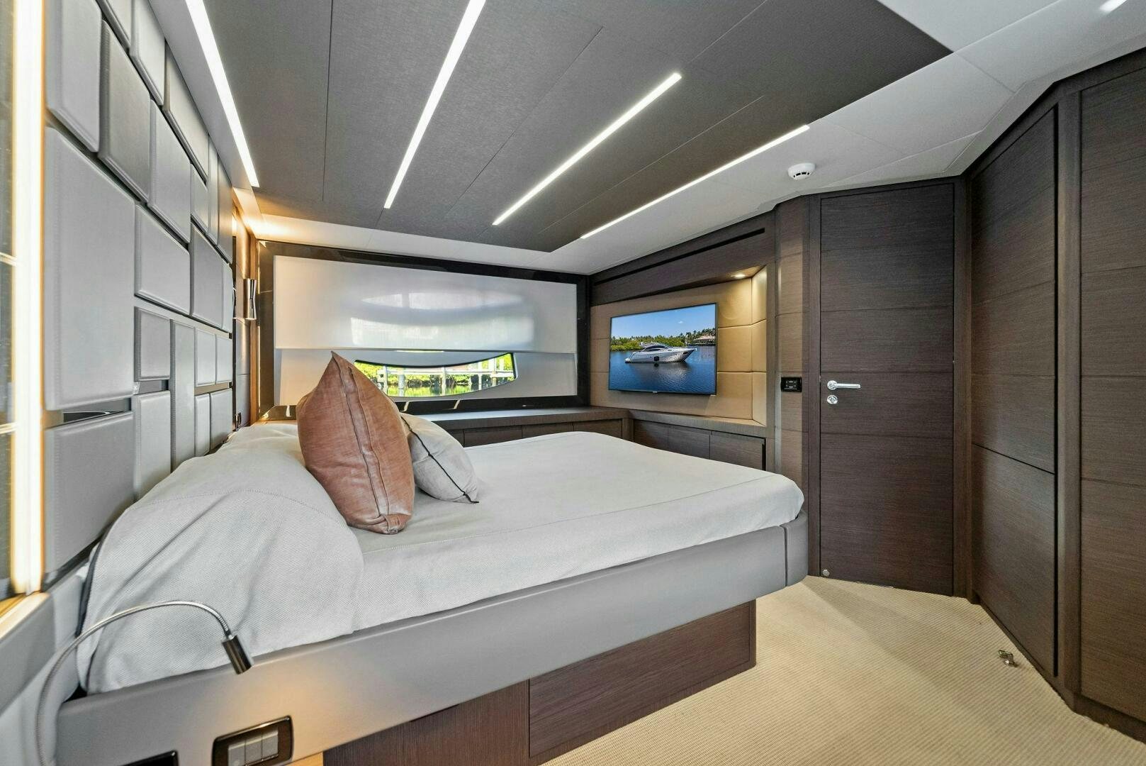 a bed in a room aboard G Yacht for Sale