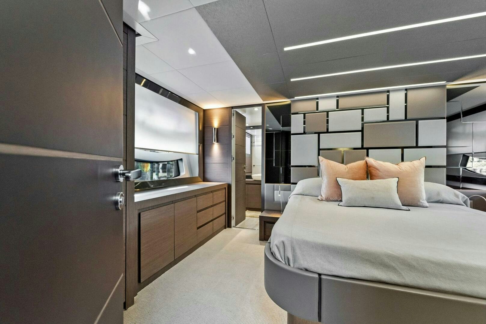 a room with a bed and a mirror aboard G Yacht for Sale
