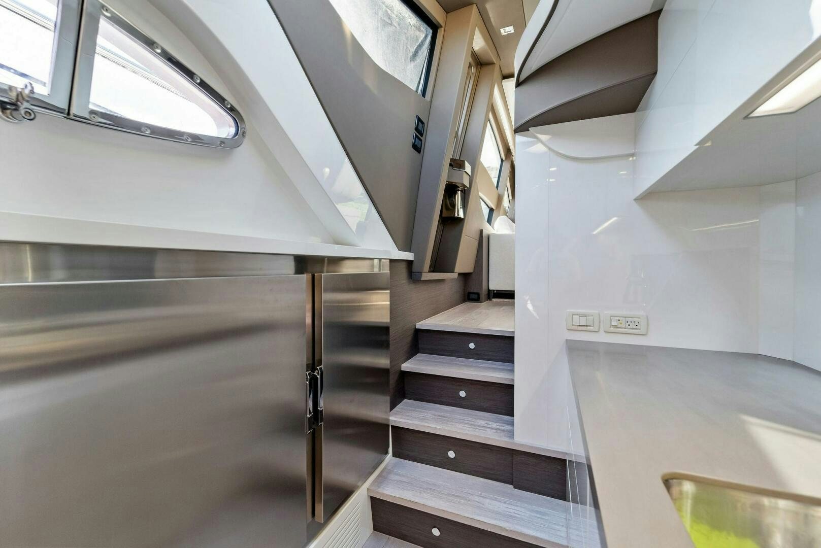 a staircase with a white wall aboard G Yacht for Sale