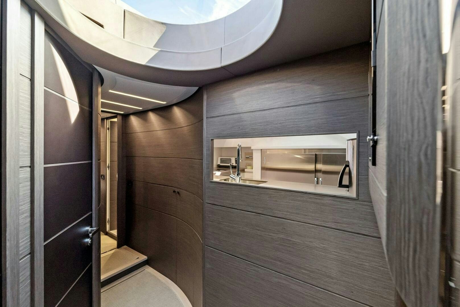 a room with a wood floor and a mirror aboard G Yacht for Sale