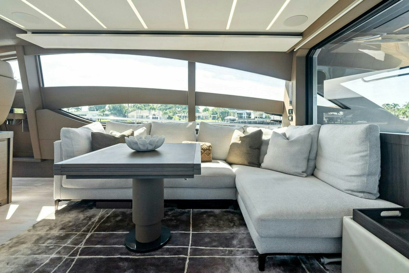 a couch and a table in a room aboard G Yacht for Sale