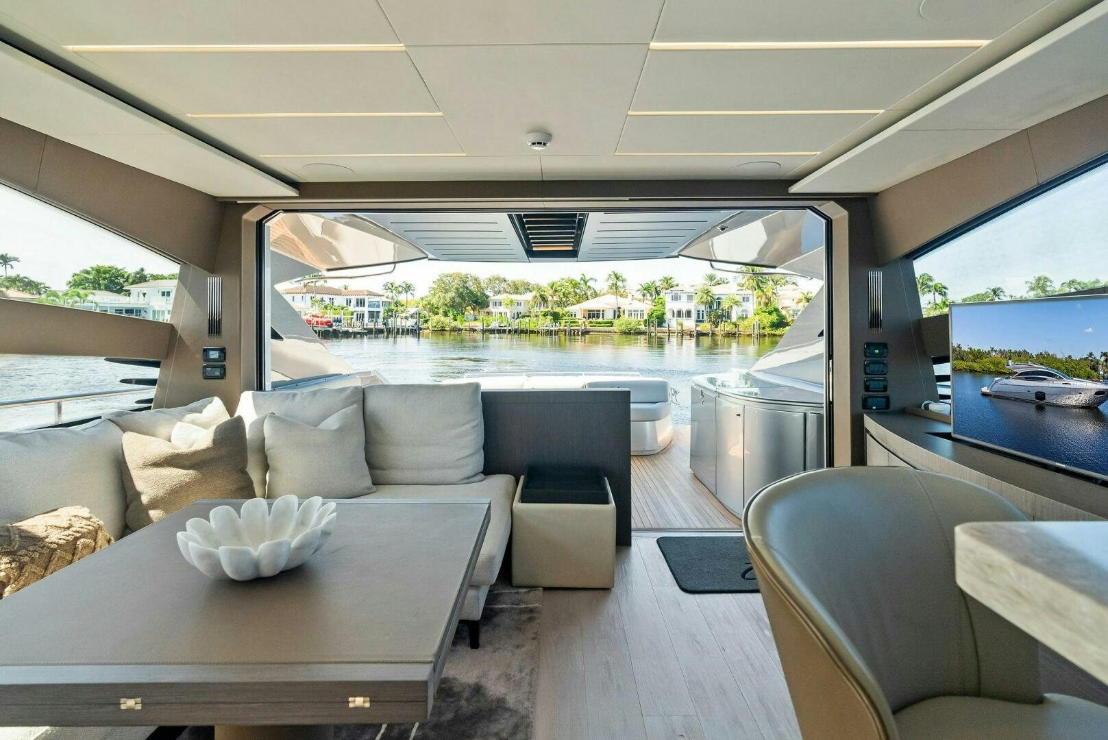 a living room with a large window aboard G Yacht for Sale