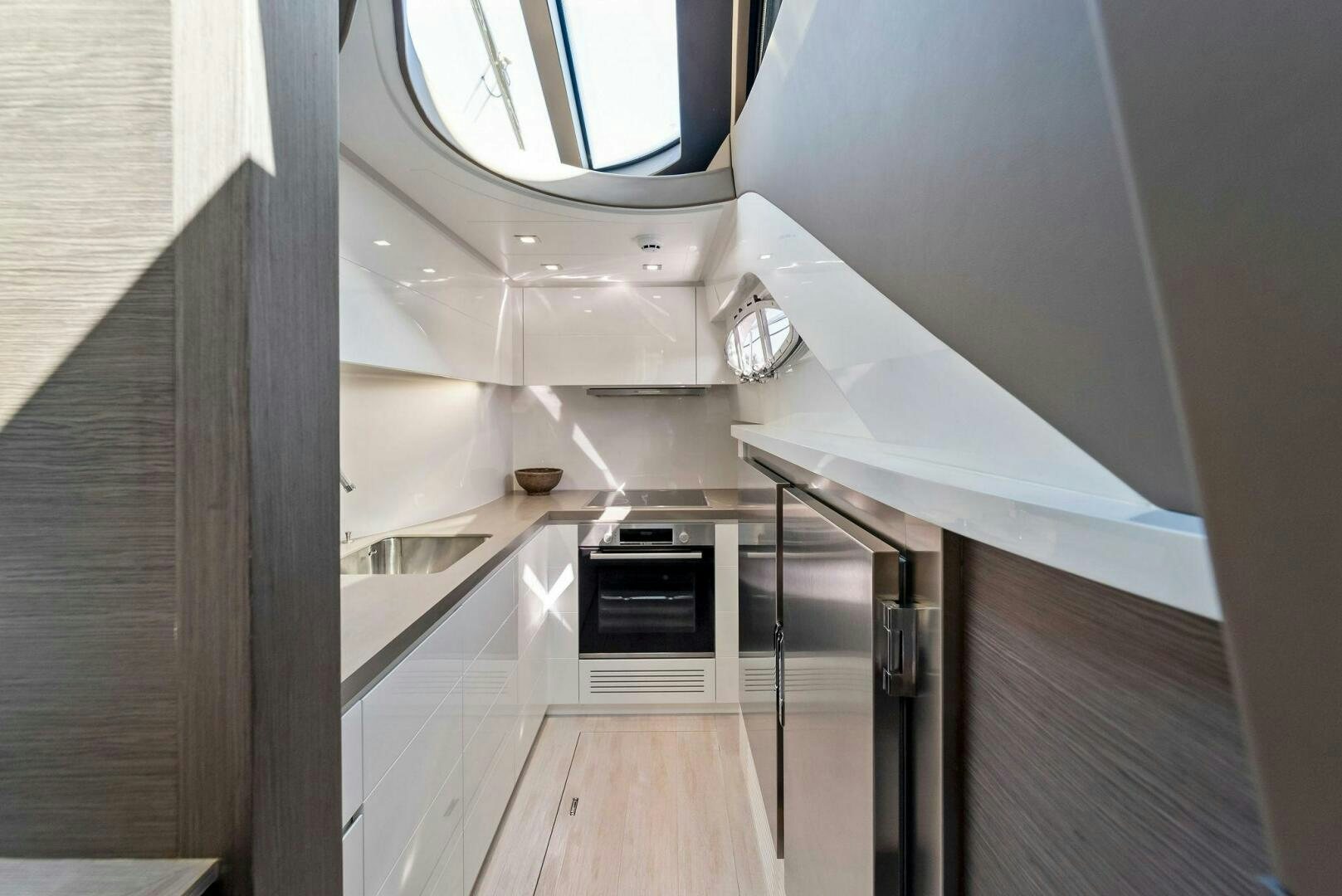 a room with a wood floor and a stove aboard G Yacht for Sale