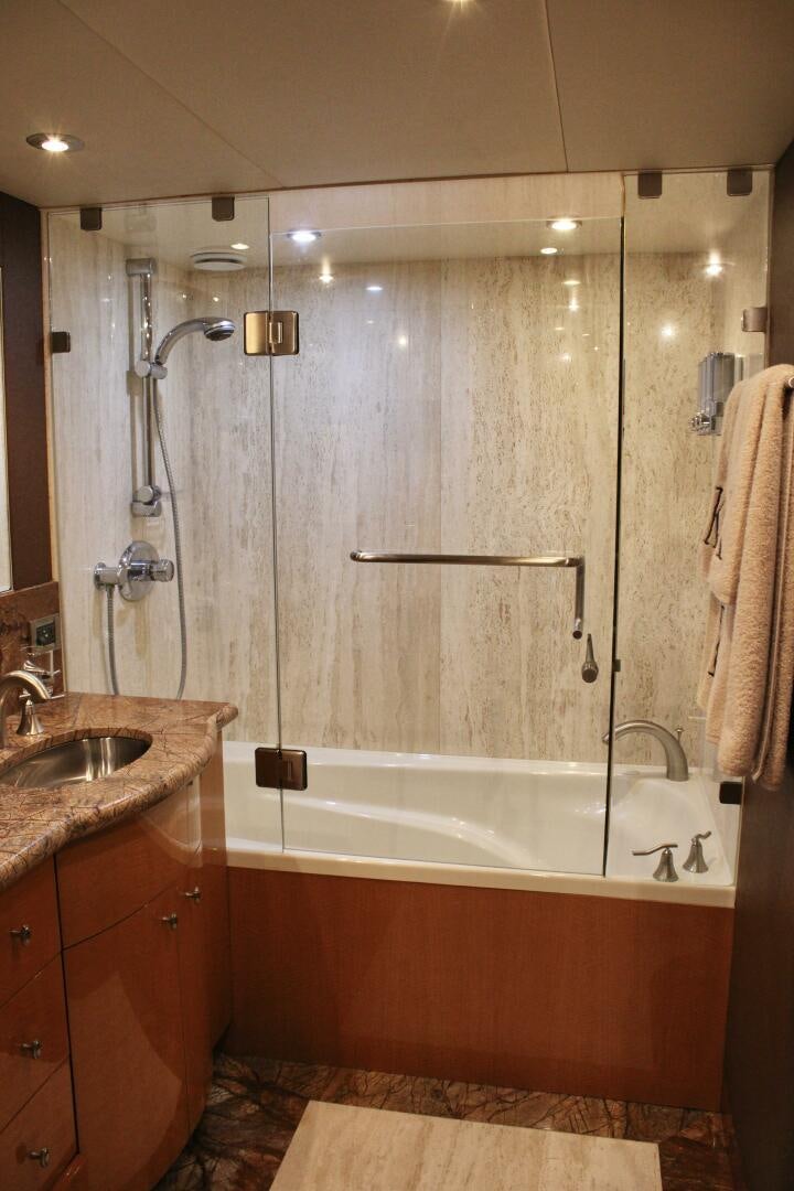 a bathroom with a sink and bathtub aboard KATHLEEN Yacht for Sale