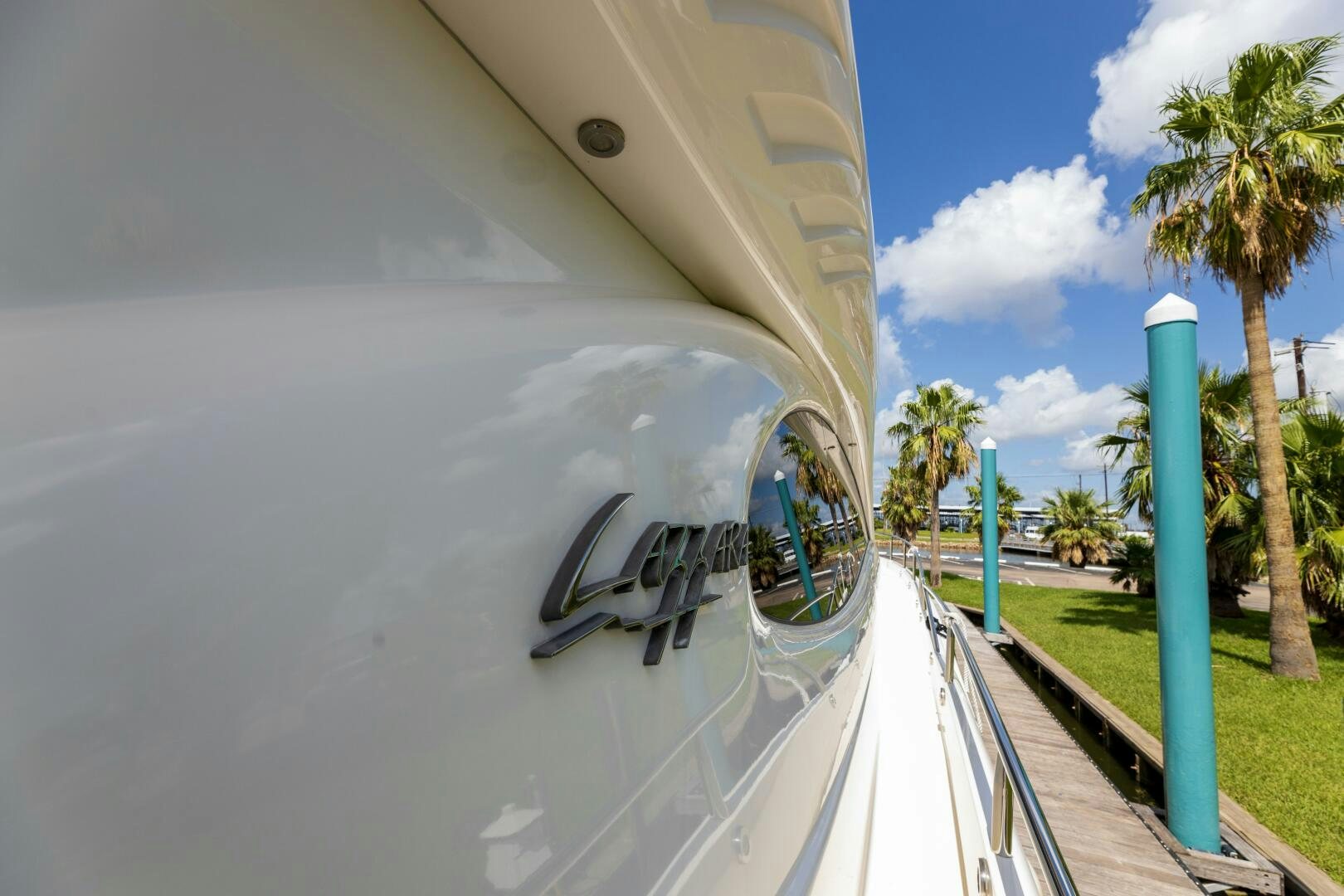 a white boat with a blue pole aboard KATHLEEN Yacht for Sale