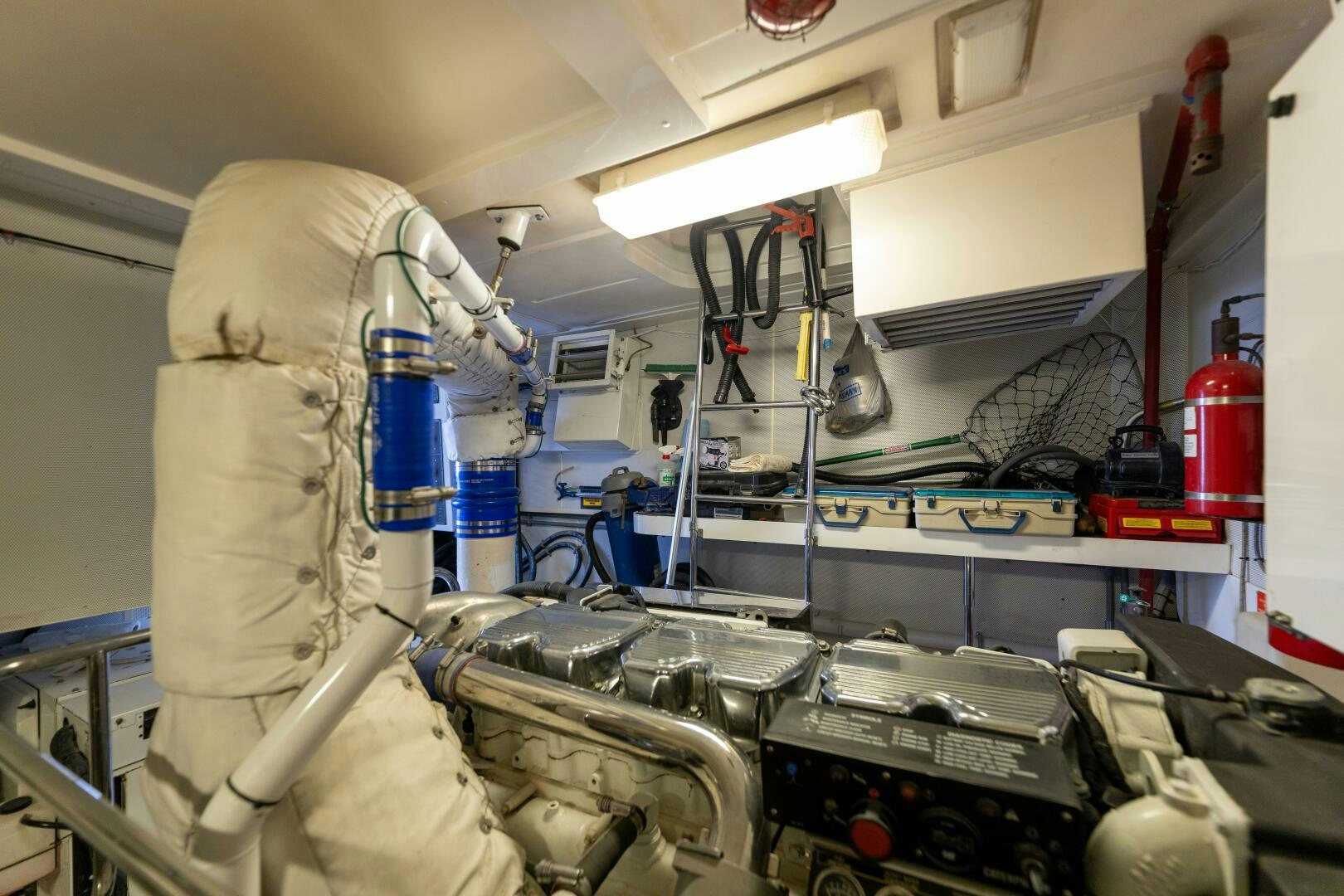 a person in a white coat working in a factory aboard KATHLEEN Yacht for Sale