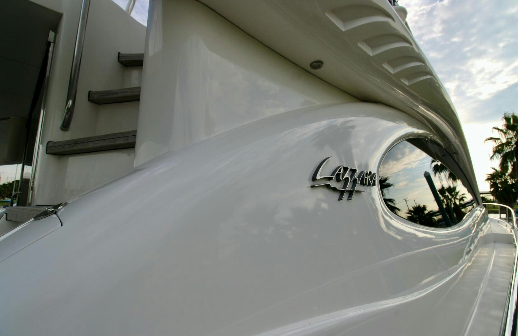 a white car with a logo on it aboard KATHLEEN Yacht for Sale