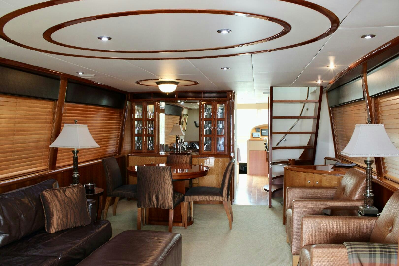a living room with a large table and chairs aboard KATHLEEN Yacht for Sale
