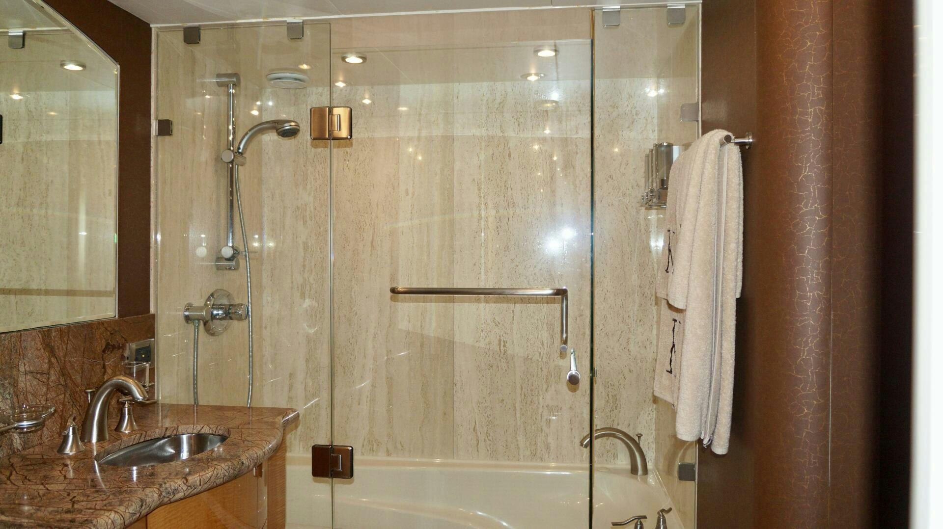 a bathroom with a glass shower aboard KATHLEEN Yacht for Sale