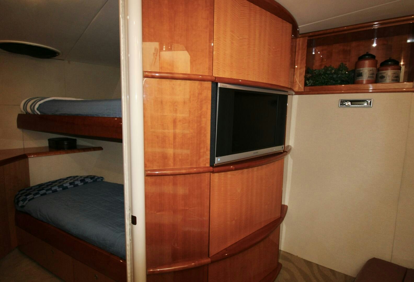 a room with a bed and a television aboard KATHLEEN Yacht for Sale