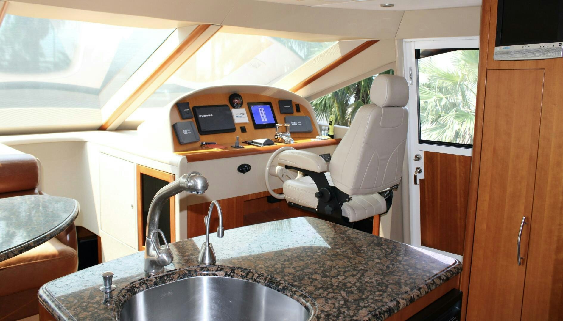 a kitchen with a sink and a microwave aboard KATHLEEN Yacht for Sale