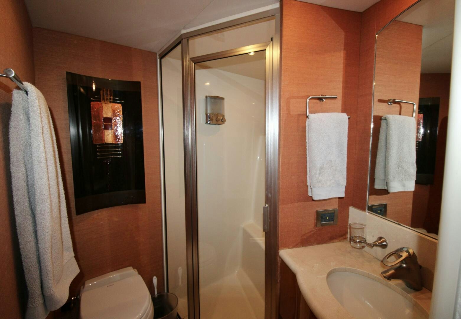 a bathroom with a mirror and sink aboard KATHLEEN Yacht for Sale