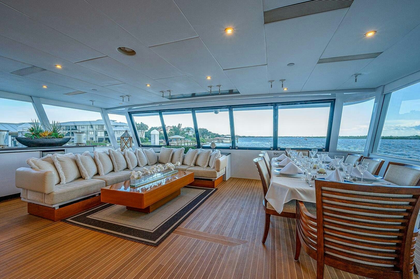 a living room with a large window aboard LA SIRENA Yacht for Sale