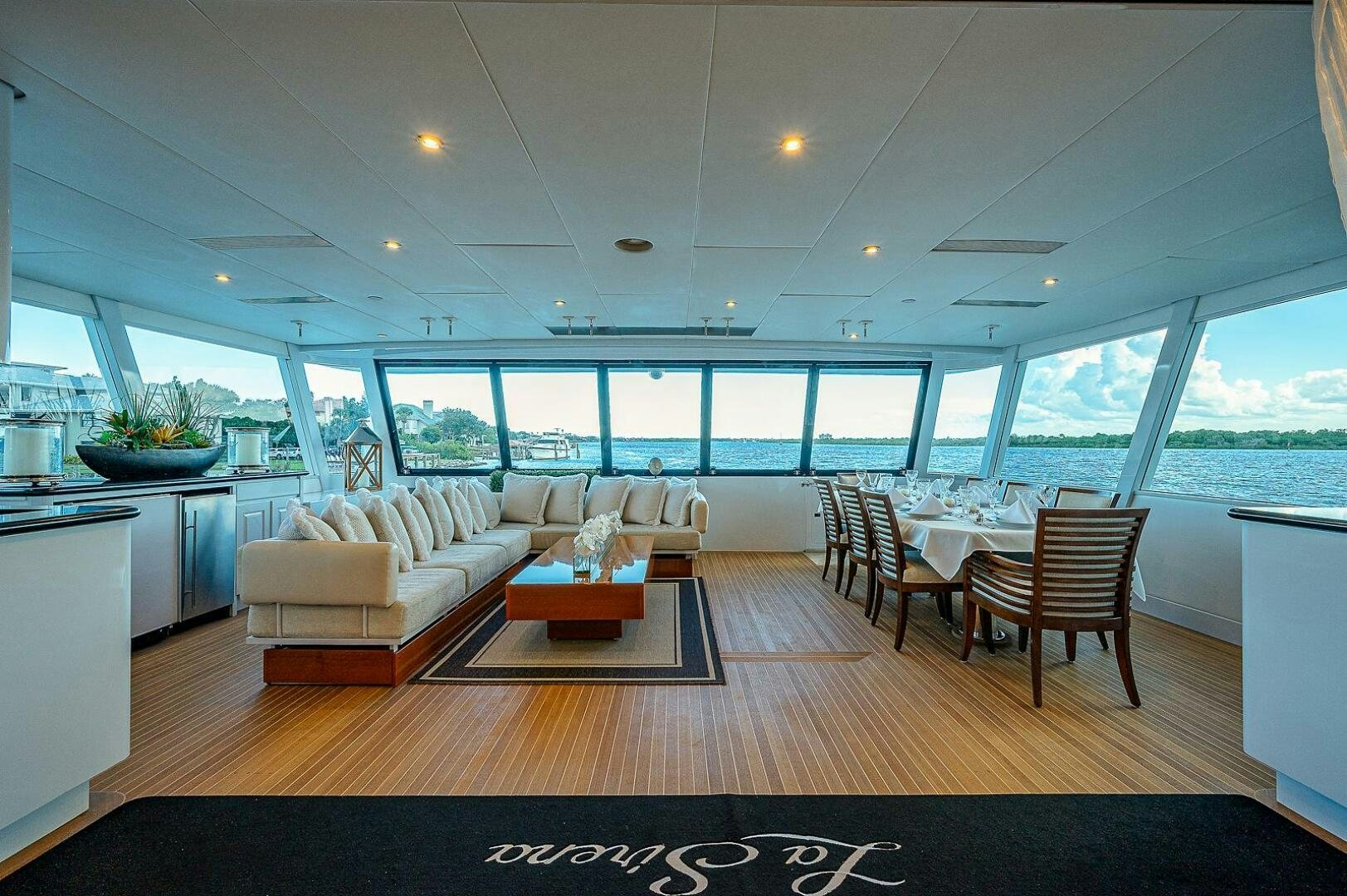 a large living room with a large window aboard LA SIRENA Yacht for Sale