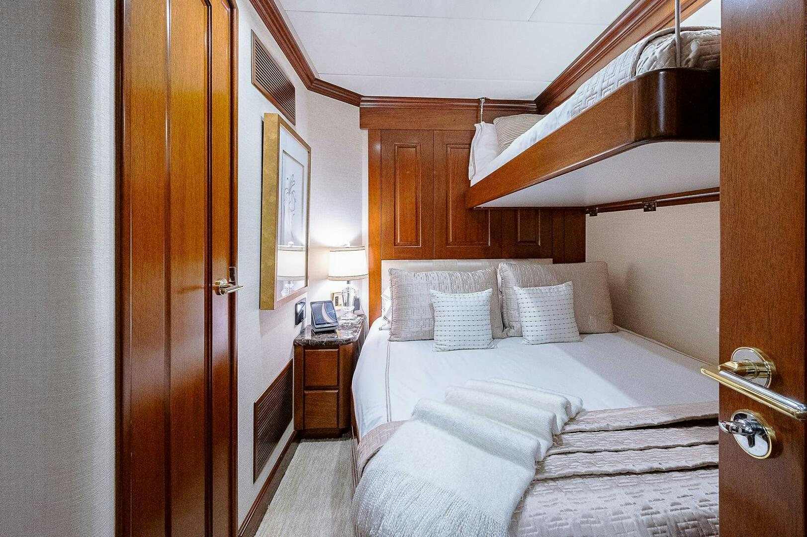 a room with a bed and a sink aboard LA SIRENA Yacht for Sale