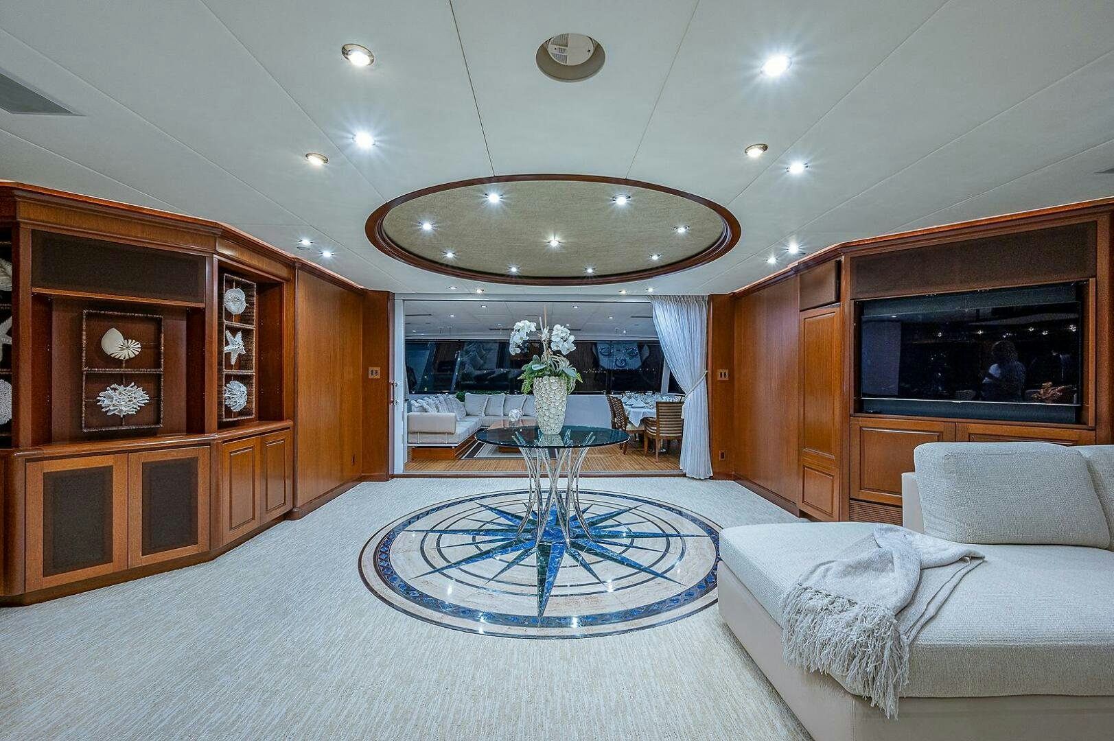a living room with a large mirror aboard LA SIRENA Yacht for Sale