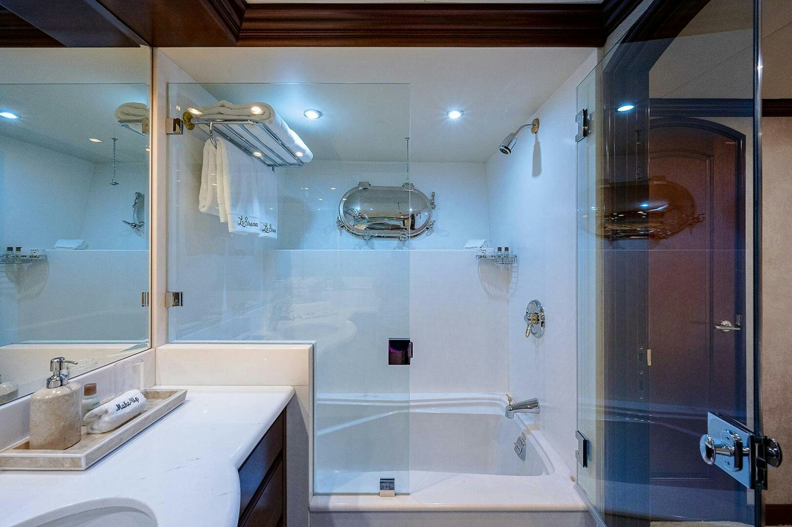 a bathroom with a glass shower aboard LA SIRENA Yacht for Sale