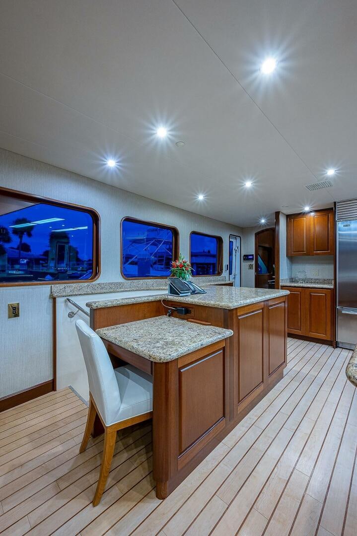 a kitchen with a large tv aboard LA SIRENA Yacht for Sale
