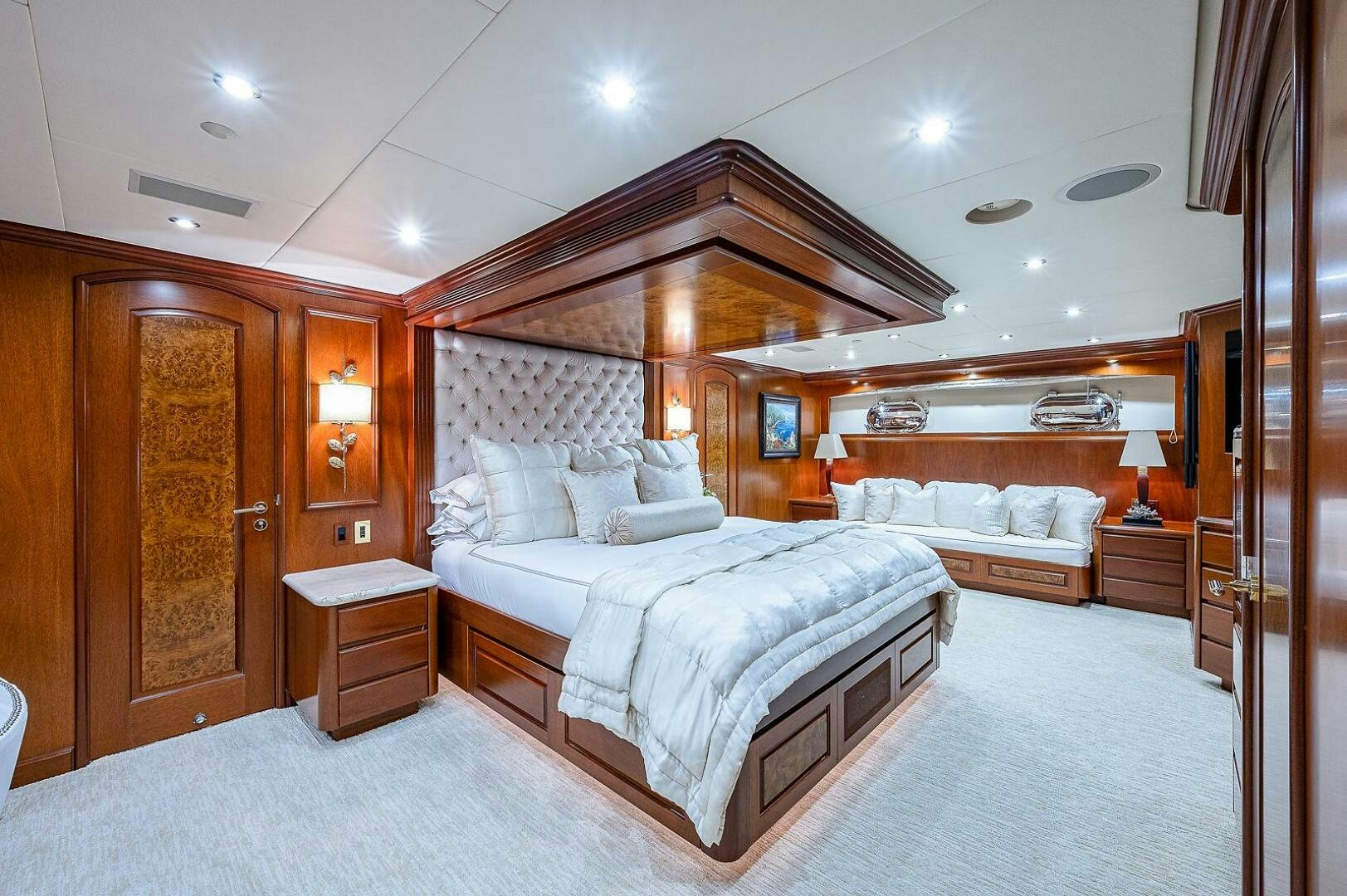 a room with a bed and a mirror aboard LA SIRENA Yacht for Sale