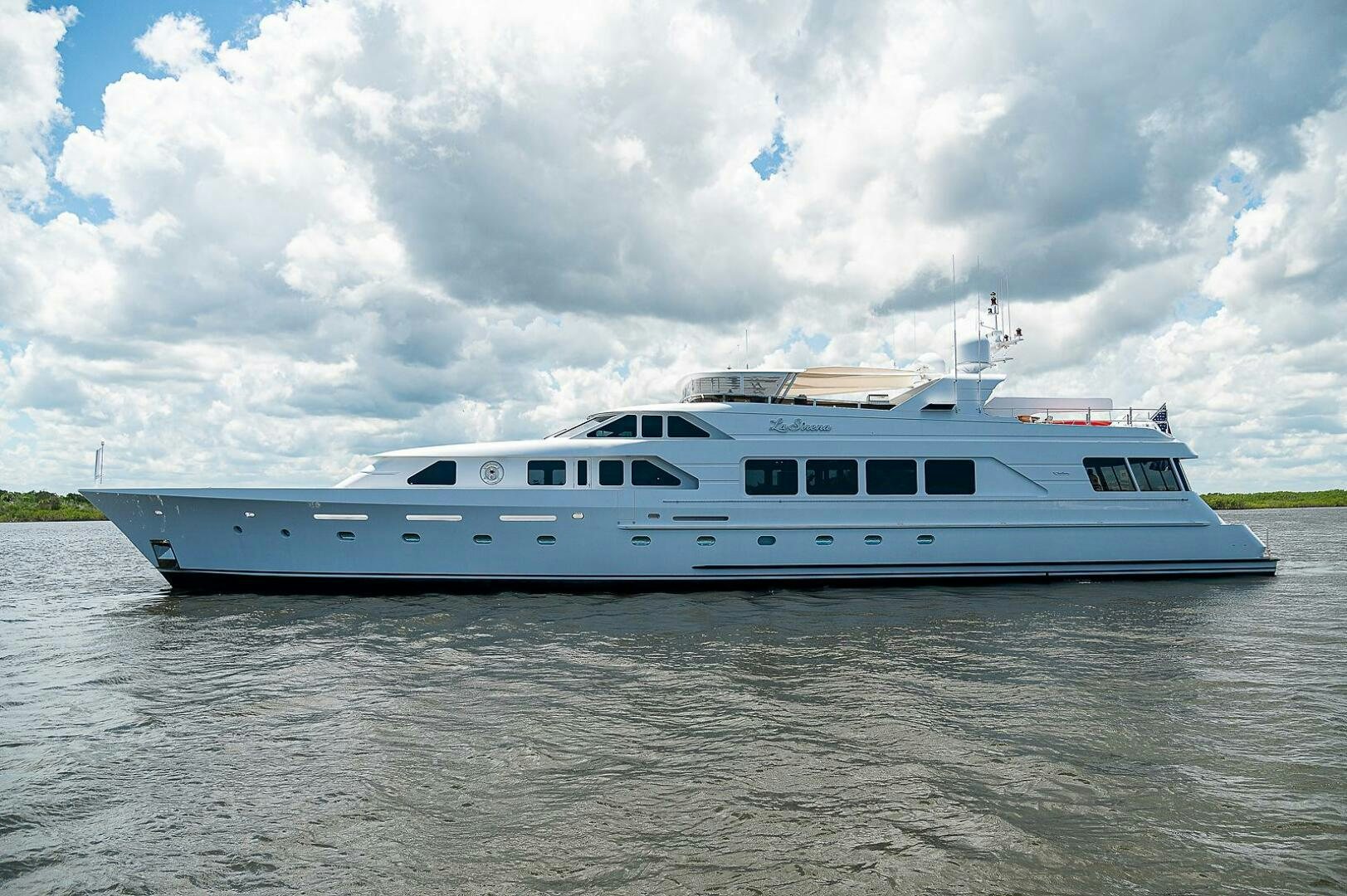 a white yacht in the water aboard LA SIRENA Yacht for Sale
