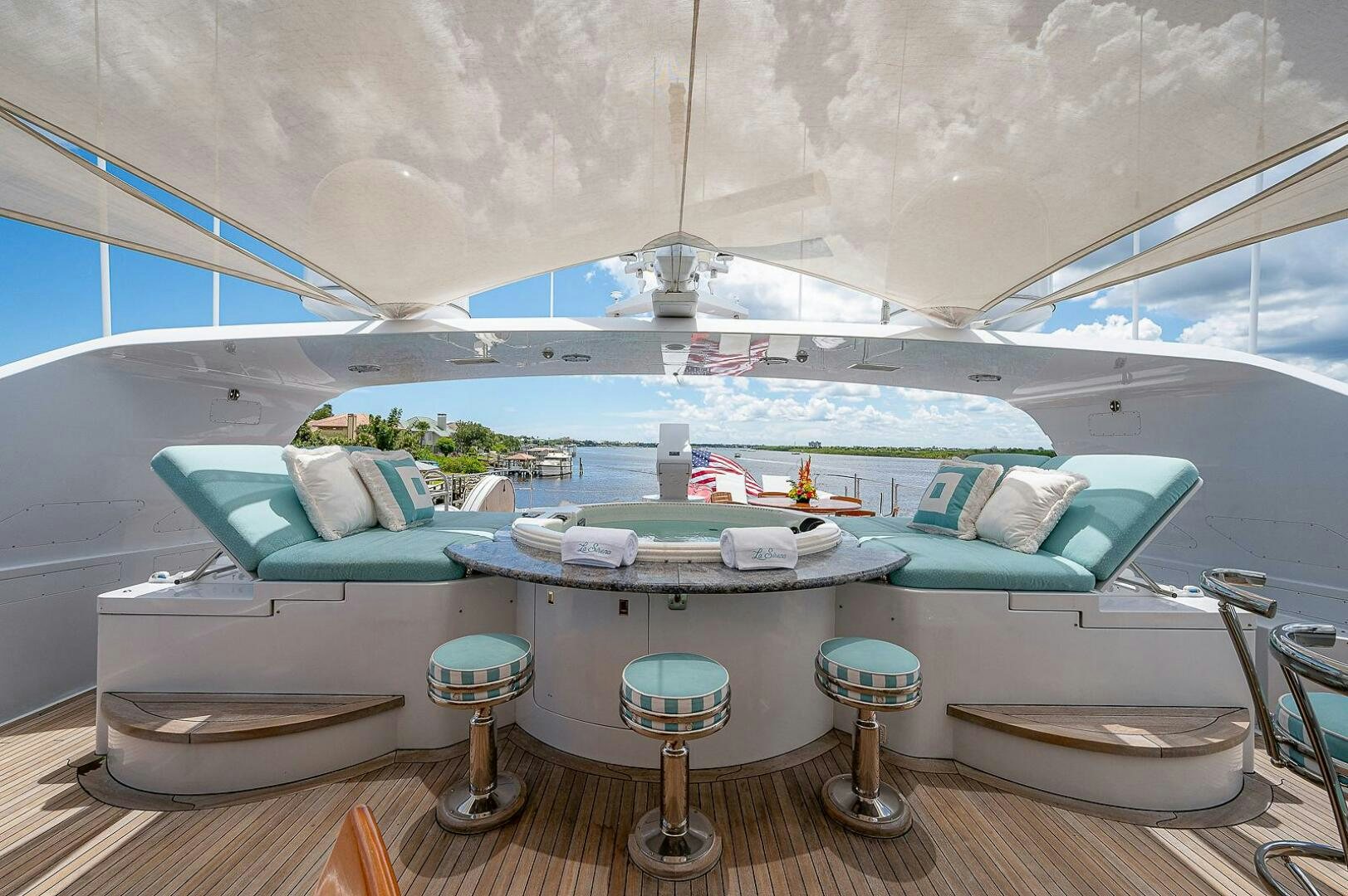 a pool with a table and chairs aboard LA SIRENA Yacht for Sale