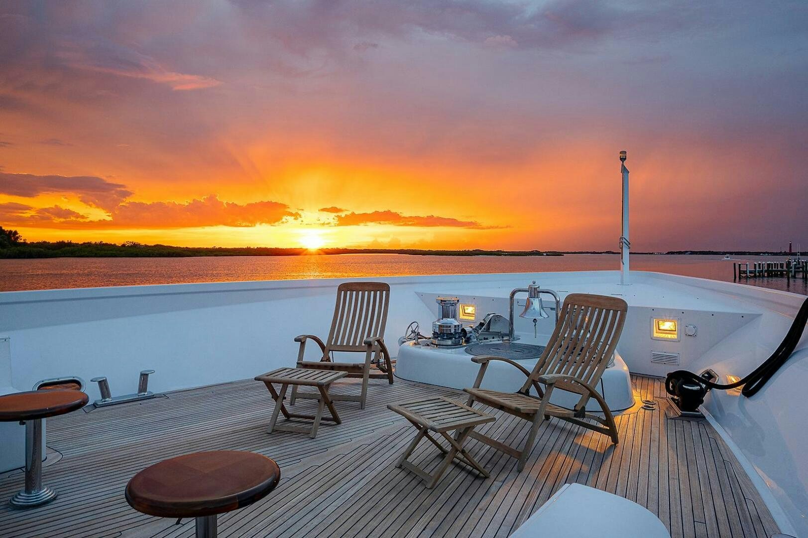 a deck with chairs and tables on it aboard LA SIRENA Yacht for Sale