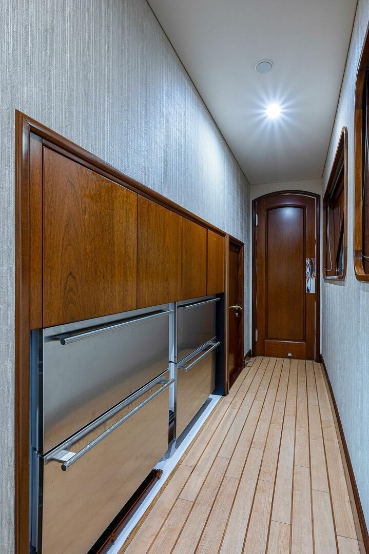 a hallway with wood cabinets aboard LA SIRENA Yacht for Sale